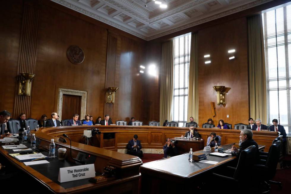 Secretary of Energy nominee Dan Brouillette, right, testifies during a Senate hearing on his no ...