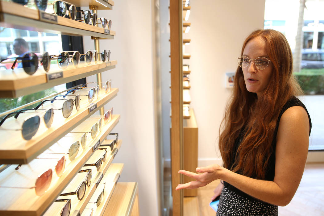 Sara Berlin, social media associate manager for Warby Parker, gives a tour of the new Warby Par ...