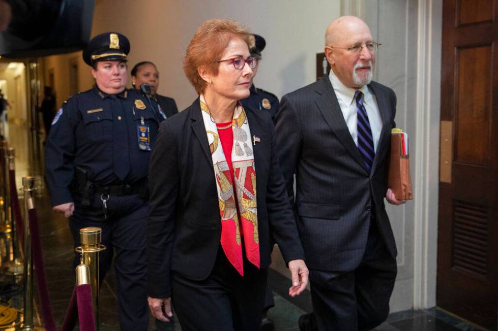 Former U.S. Ambassador to Ukraine Marie Yovanovitch walks to the hearing room to testify to the ...