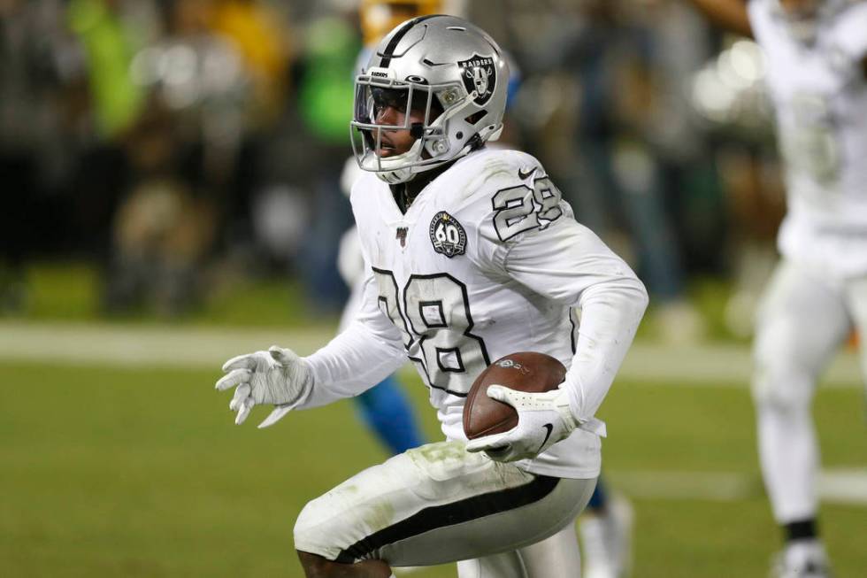 Oakland Raiders running back Josh Jacobs (28) runs toward the end zone to score against the Los ...