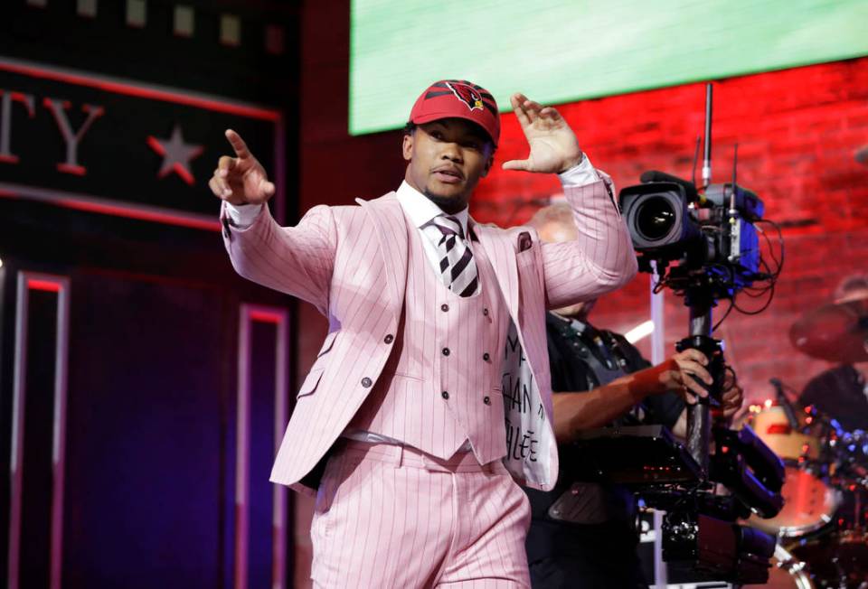 Oklahoma quarterback Kyler Murray enters the main stage after the Arizona Cardinals selected Mu ...