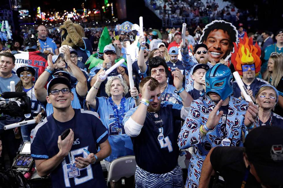 Fans watch the action on the main stage during the first round at the NFL football draft, Thurs ...