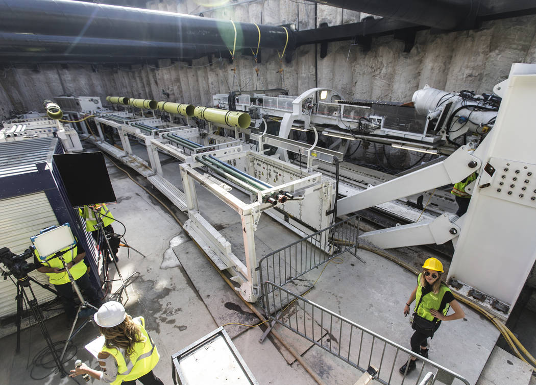 Media get a first glimpse at a tunnel boring machine at the future location of one of the under ...
