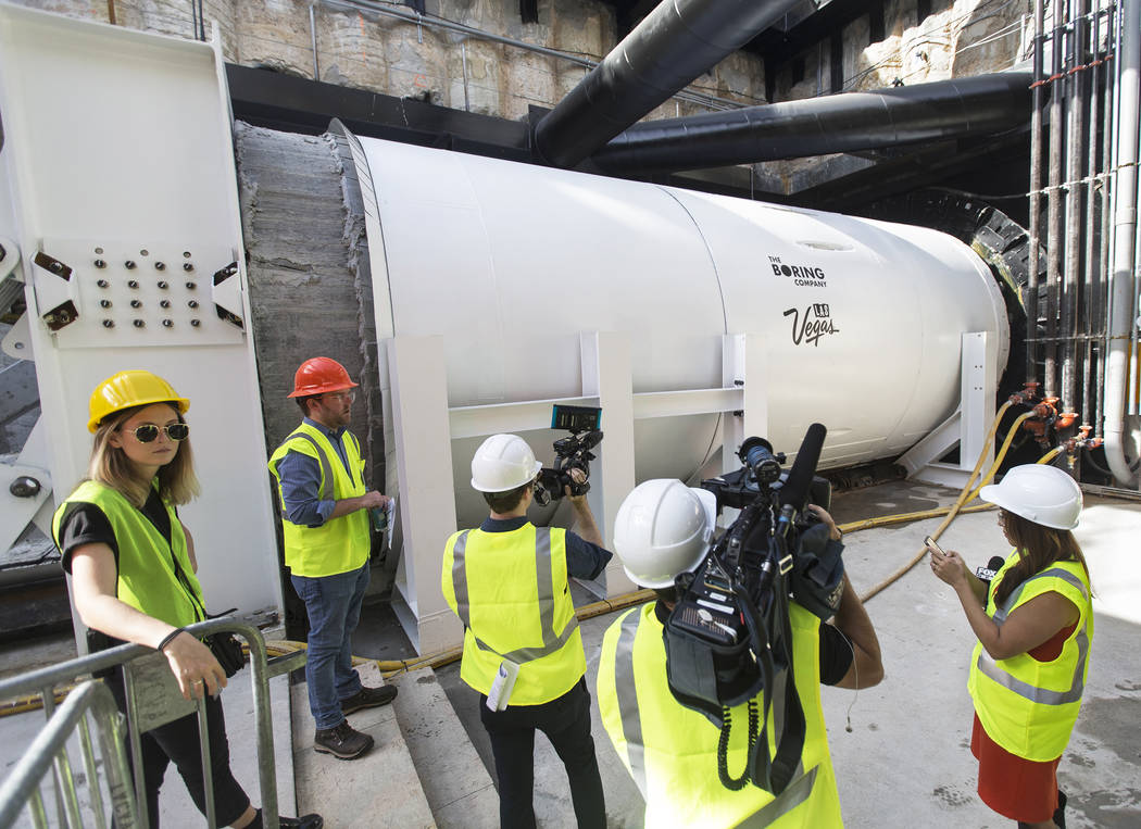 Media get a first glimpse at a tunnel boring machine at the future location of one of the under ...