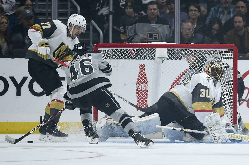 Los Angeles Kings center Blake Lizotte, second from left, shoots the puck for a short-handed go ...