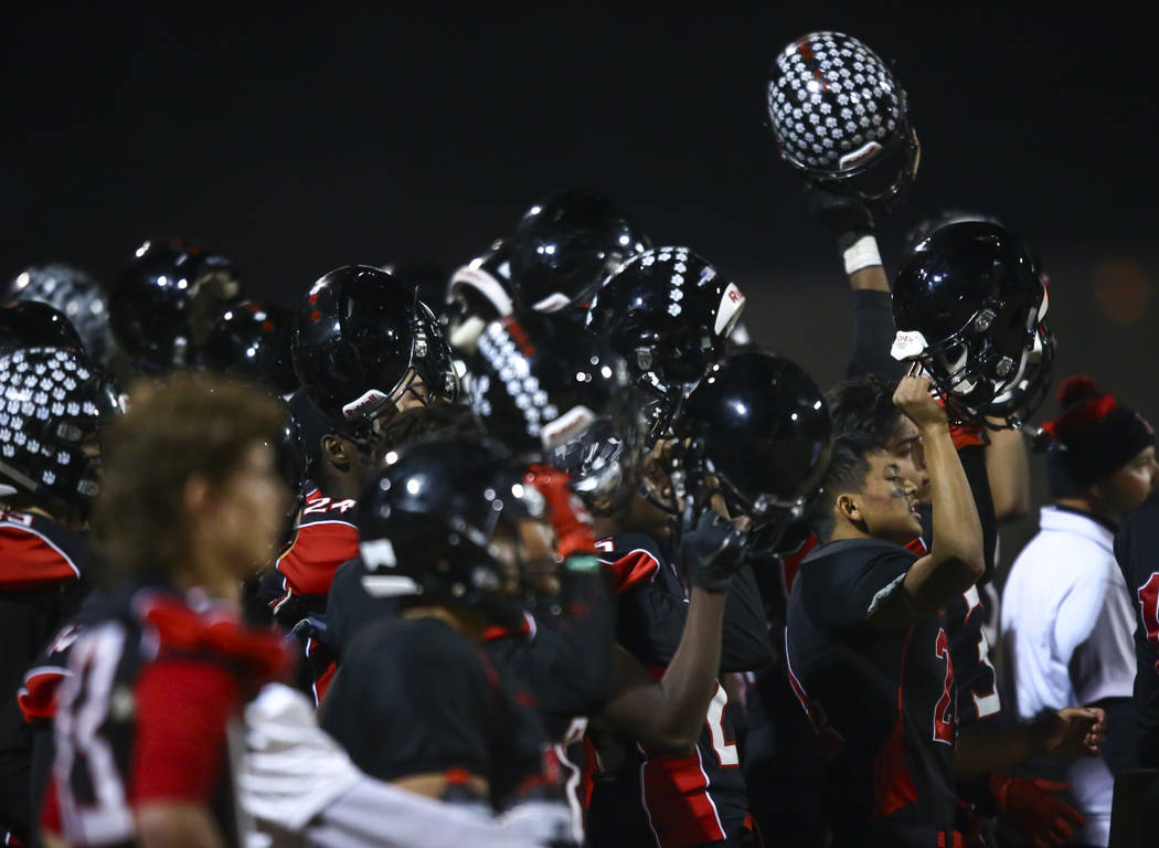 Las Vegas players cheer during the first half of a football game against Palo Verde at Las Vega ...