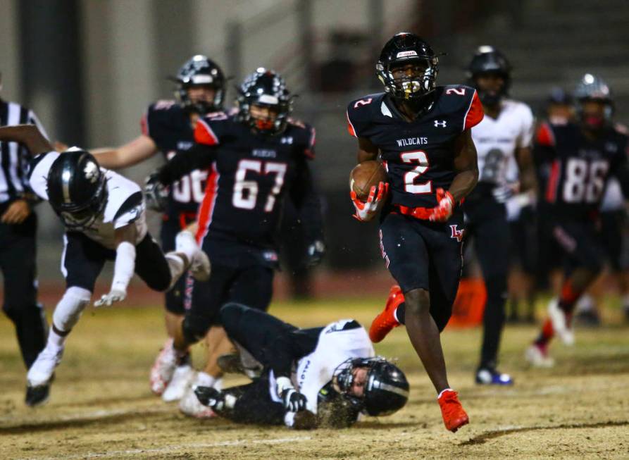 Las Vegas' Miles Davis (2) runs the ball to score a touchdown against Palo Verde during the sec ...