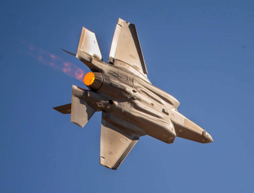 An F-35 Lightning II powers across the flight line before the crowd during the Aviation Nation ...