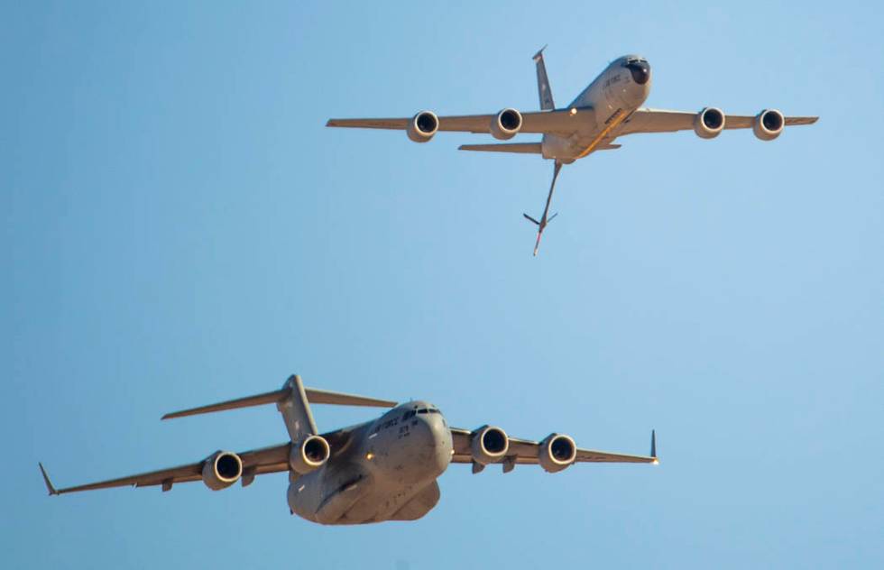 A C-17 Globemaster III, bottom left, and KC-135 Stratotanker fly together during the Aviation N ...