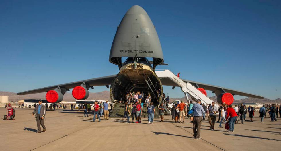 Attendees check out the Lockheed C-5 Galaxy during Aviation Nation at Nellis Air Force Base on ...
