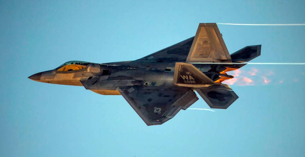 An F-22 Raptor streaks across the sky during the Aviation Nation at Nellis Air Force Base on Sa ...