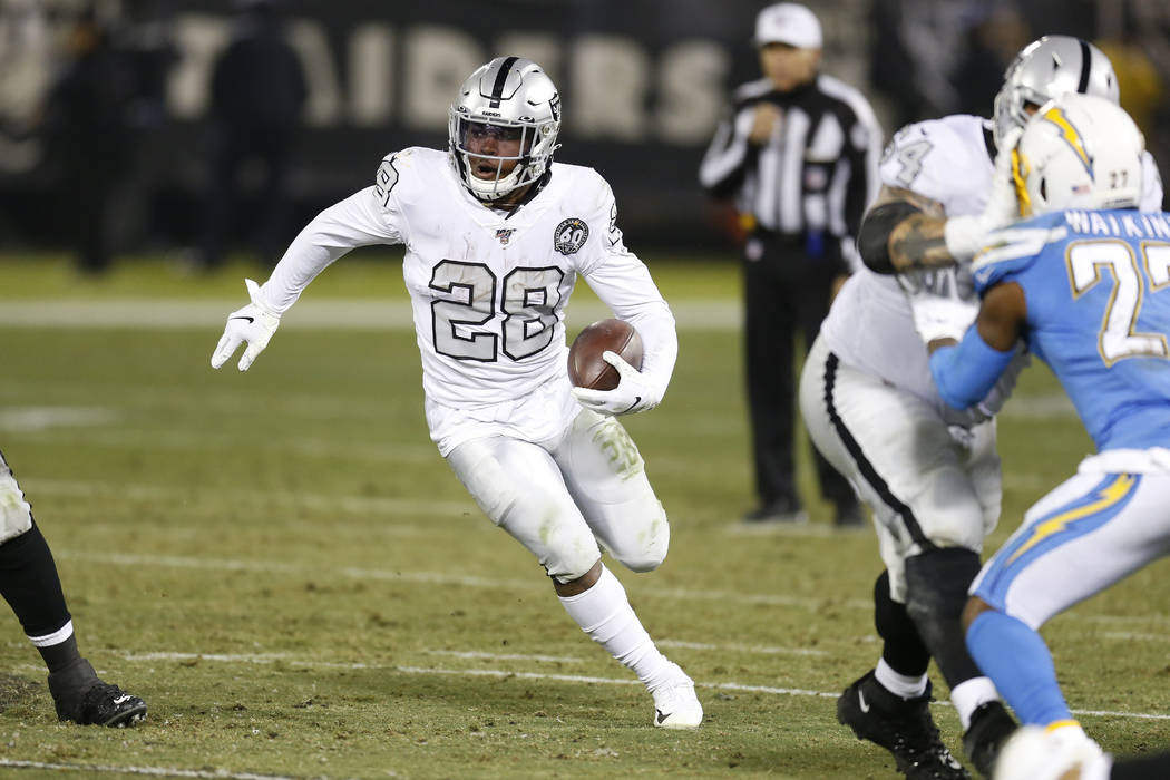 Oakland Raiders running back Josh Jacobs (28) runs against the Los Angeles Chargers during the ...