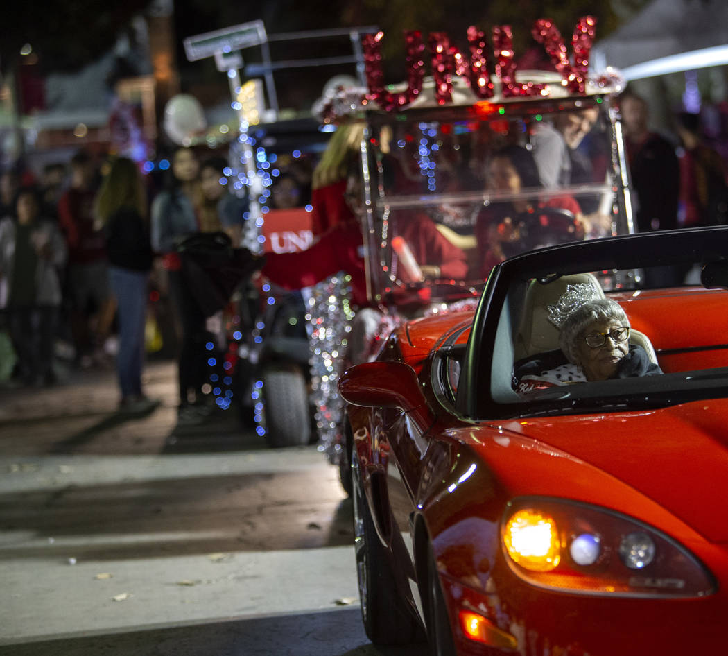 Audrey James, 105, rides through the UNLV homecoming parade as honorary homecoming queen on Fri ...