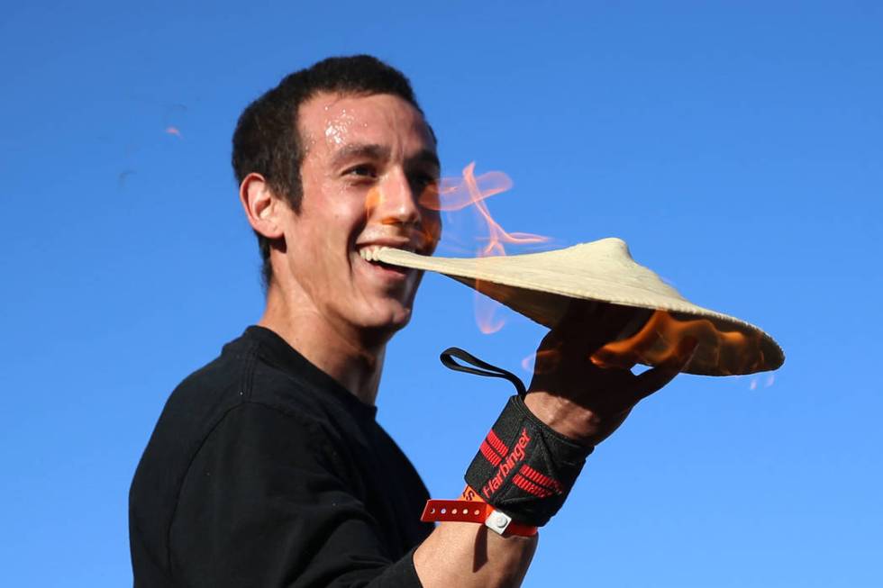 Pizza spinning acrobat Scott Volpe of Tucson, Ariz., performs during the Las Vegas Pizza Festiv ...