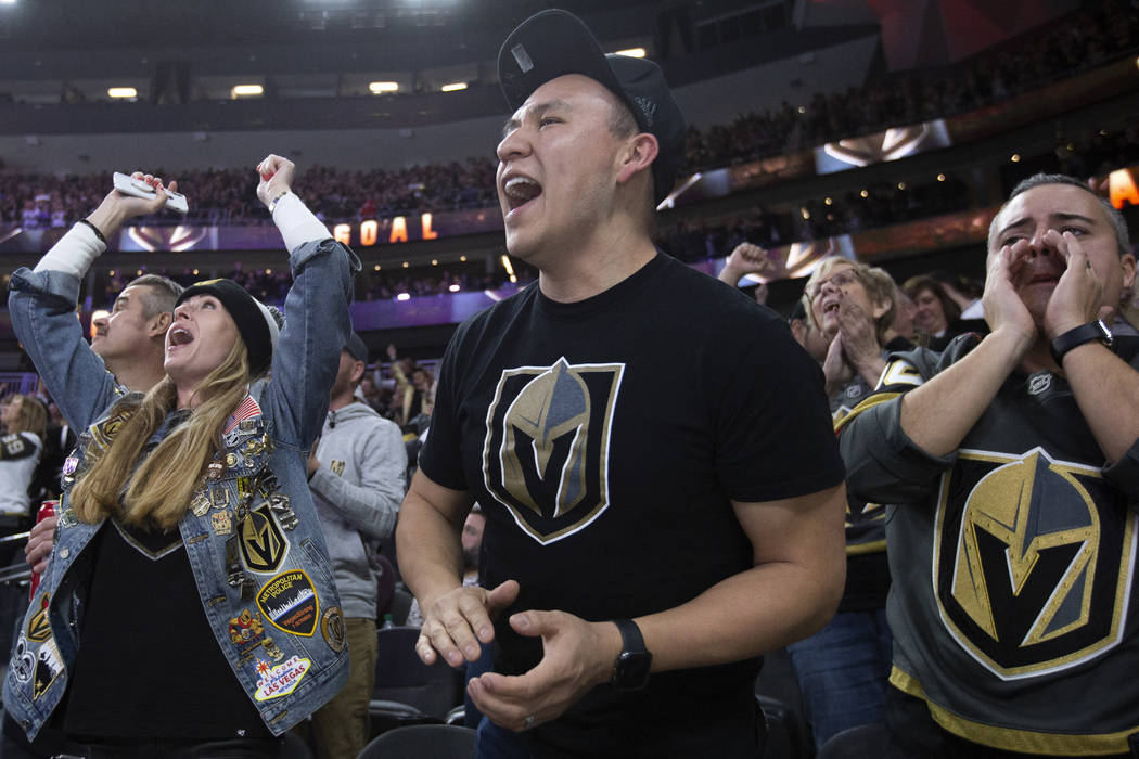 Renee Powell, left, Humberto Galindo, center, and Homero Gonzalez, right, celebrate a Golden Kn ...