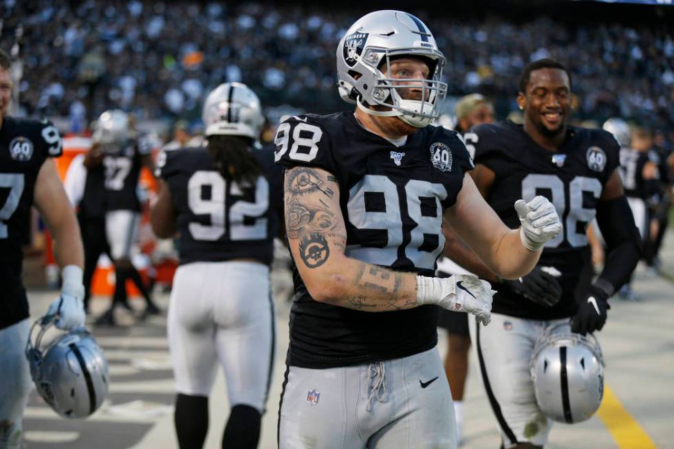 Oakland Raiders defensive end Maxx Crosby (98) on the bench during the second half of an NFL fo ...