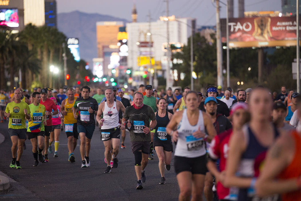 Runners make their way south on the Strip for the Rock 'n' Roll Marathon in Las Vegas, Sunday, ...