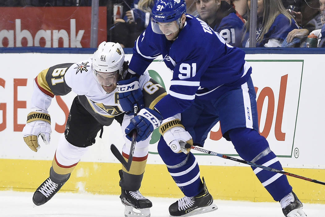 Vegas Golden Knights right wing Mark Stone (61) and Toronto Maple Leafs center John Tavares (91 ...