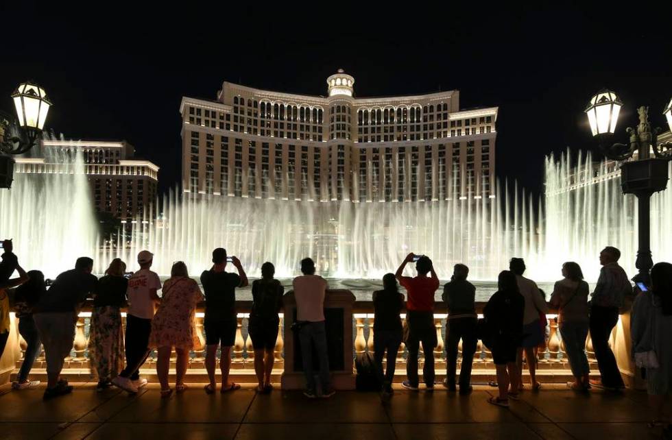 People watch the water fountain show outside the Bellagio on the Las Vegas Strip. (Richard Bria ...