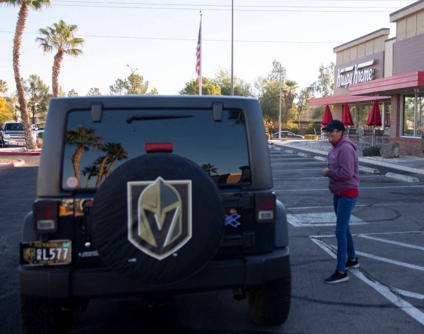 Krispy Kreme processors Sandra Nunez tells a Golden Knight fan that the store is closed at the ...