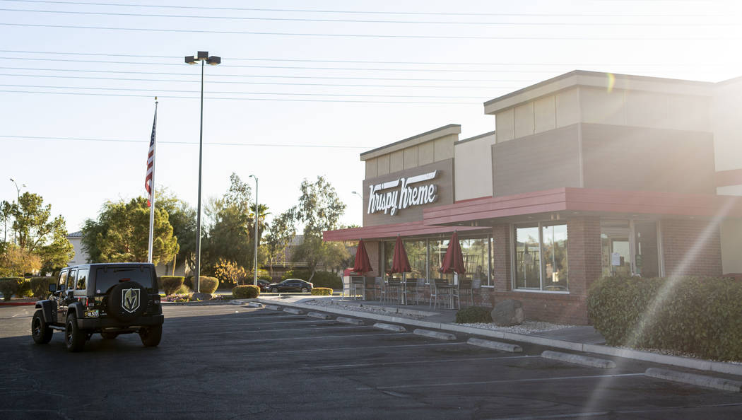 Golden Knight fans drive up to the Krispy Kreme store at 9791 S. Eastern Ave. in Henderson on M ...