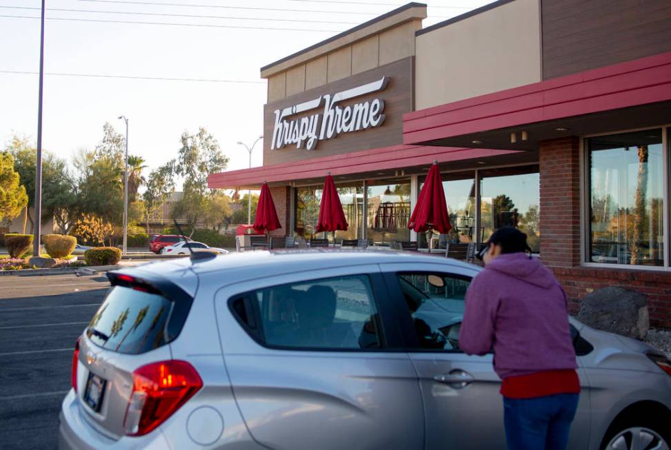 Golden Knight fans drive up to the Krispy Kreme store at 9791 S. Eastern Ave. in Henderson on M ...