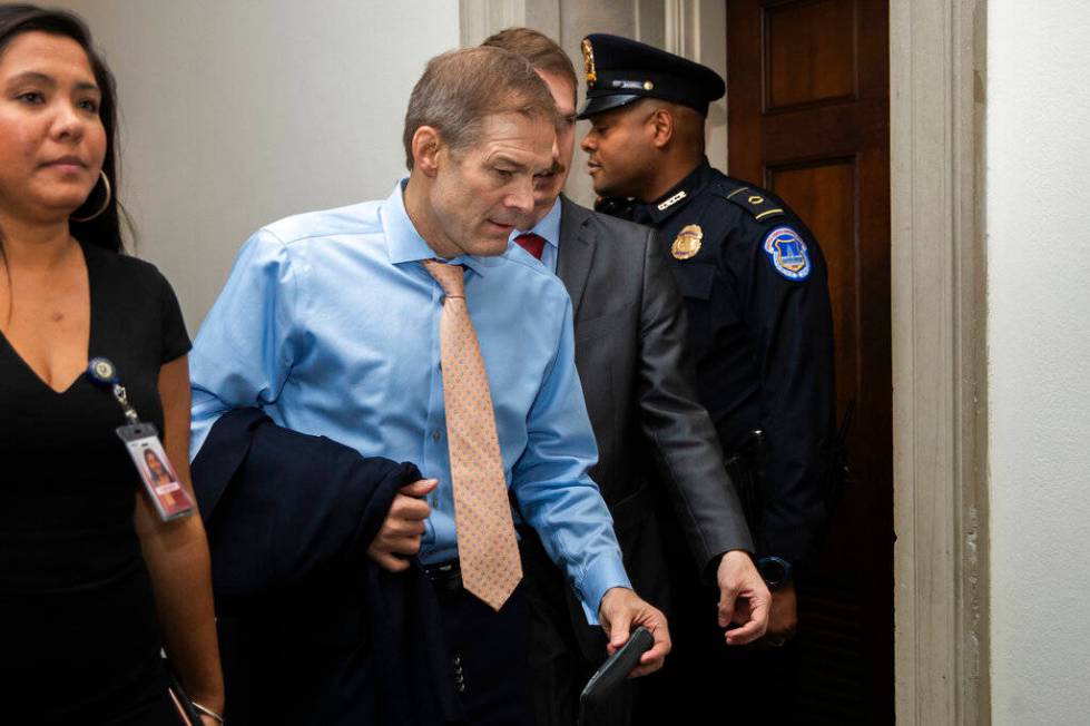 Rep. Jim Jordan, R-Ohio, leaves the hearing room as they conclude the public impeachment hearin ...