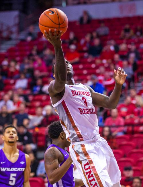 UNLV Rebels guard Amauri Hardy (3) drives the lane for a lay up versus the Abilene Christian Wi ...