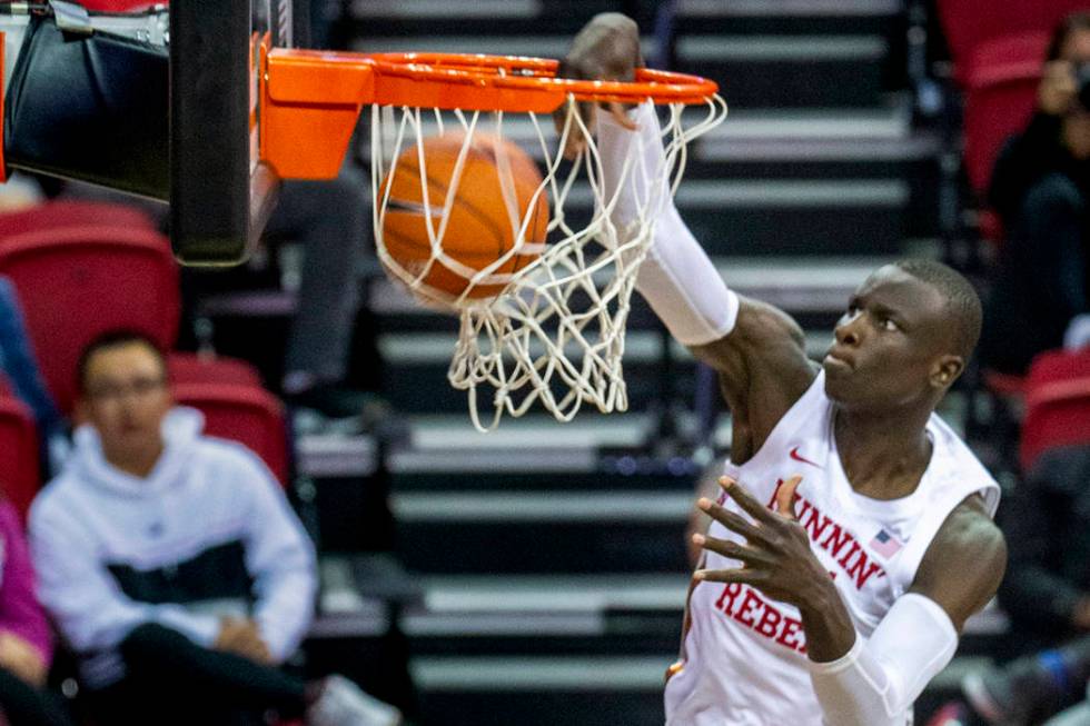 UNLV Rebels forward Mbacke Diong (34) dunks the ball over the Abilene Christian Wildcats defens ...