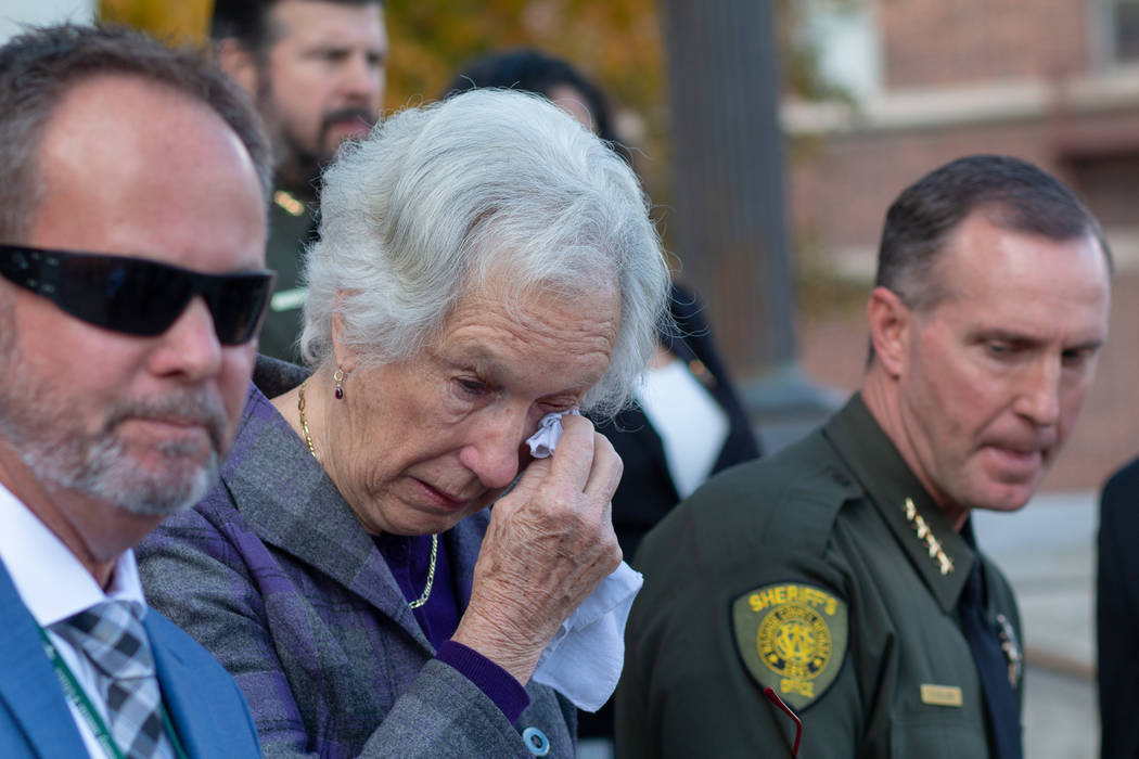 Cecily O'Connor, center, wipes away a tear during a press conference following the arraignment ...
