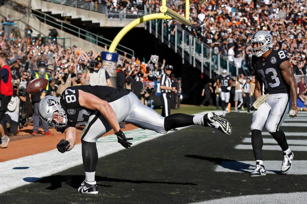 Oakland Raiders tight end Foster Moreau (87) celebrates after scoring a touchdown as tight end ...