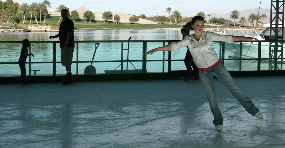 Grace Peuser, 12, figure skates on the floating ice skating rink at the MonteLago Village at La ...