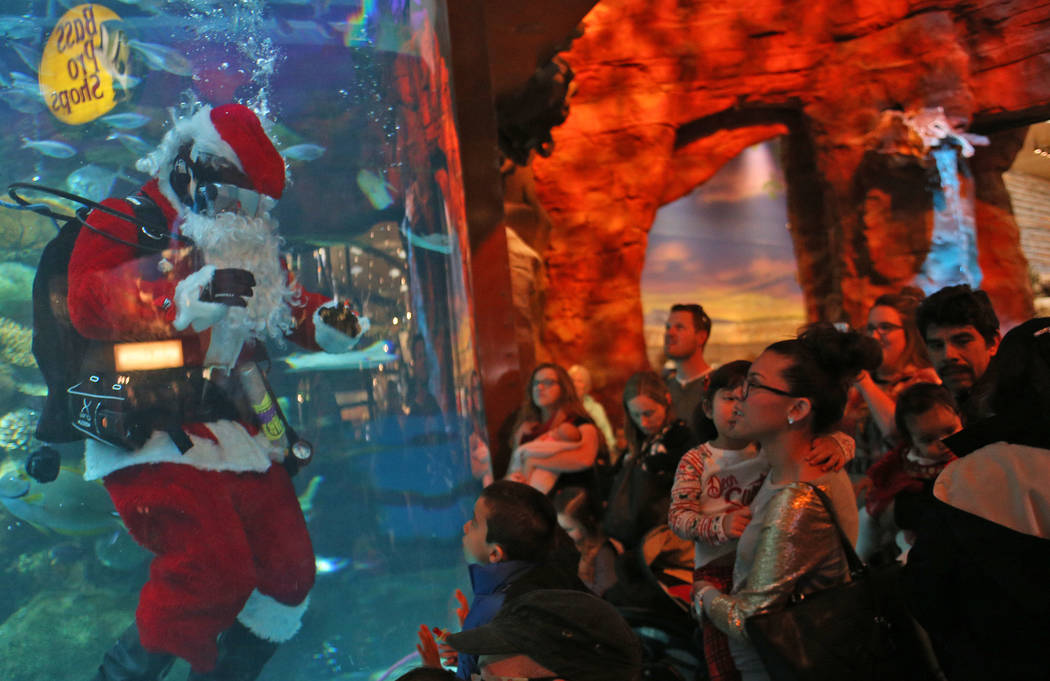 Underwater Santa greets the crowd at Silverton hotel and casino in Las Vegas, Sunday, Dec. 2, 2 ...