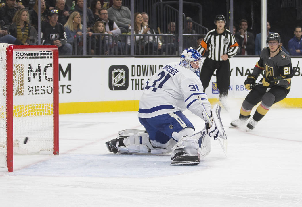 Vegas Golden Knights center Cody Eakin (21) watches his shot go wide of Toronto Maple Leafs goa ...