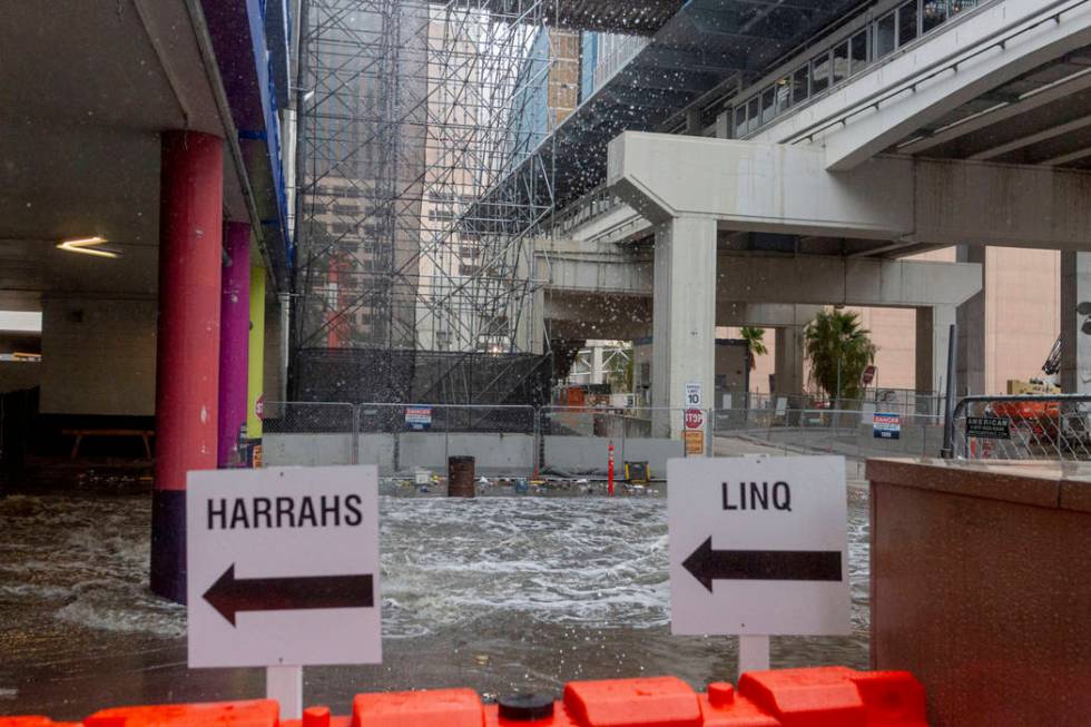 Heavy rain waters cause flooding at the LINQ parking garage on the Strip in Las Vegas on Wednes ...