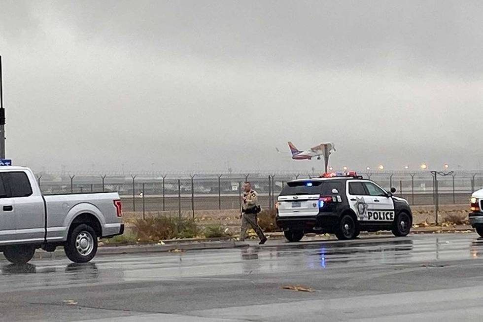 A Las Vegas police officer investigates a minor crash on Sunset Road near McCarran Internationa ...