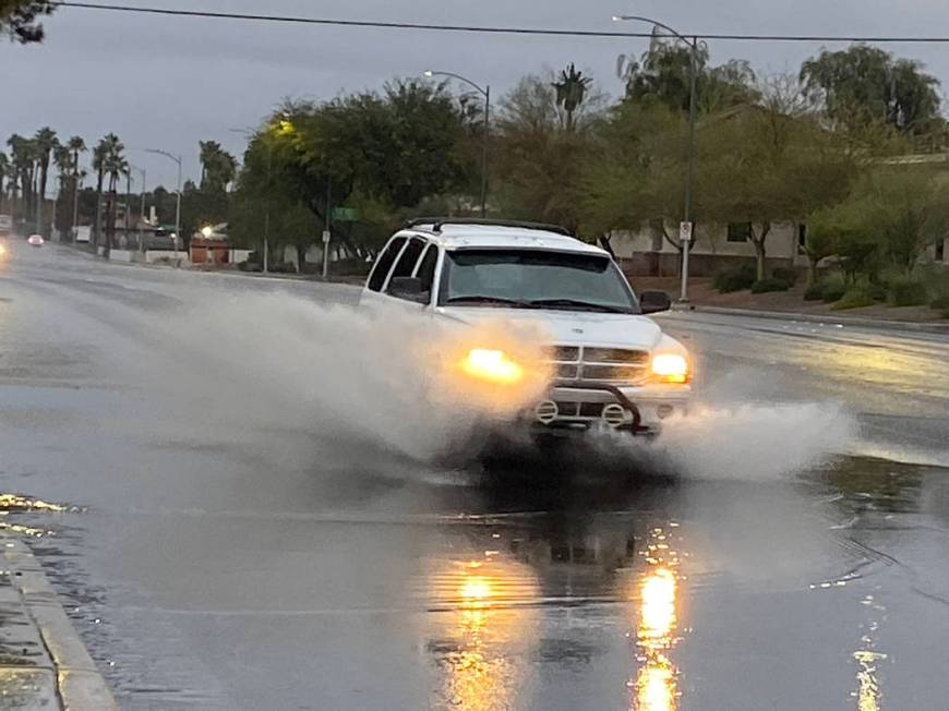 A truck sends a shower of water near Eastern Avenue and Viking Road on Wednesday, Nov. 20, 2019 ...