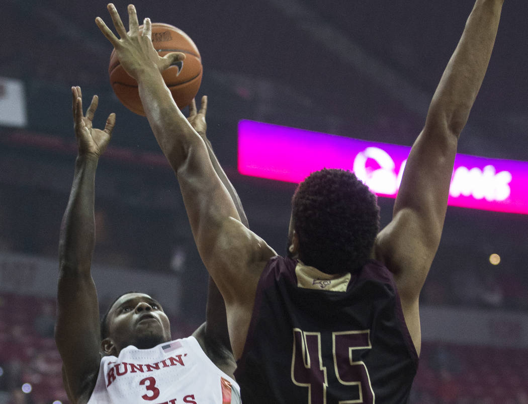 UNLV Rebels guard Amauri Hardy (3) shoots a jump shot over Texas State Bobcats forward Eric Ter ...