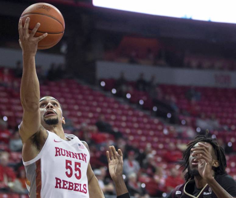 UNLV Rebels guard Elijah Mitrou-Long (55) drives past Texas State Bobcats forward Isiah Small ( ...