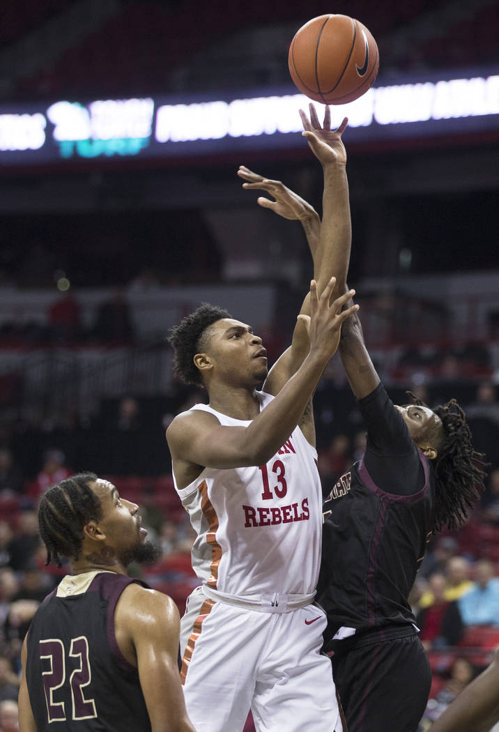 UNLV Rebels guard Bryce Hamilton (13) shoots over Texas State Bobcats forward Isiah Small (1) a ...