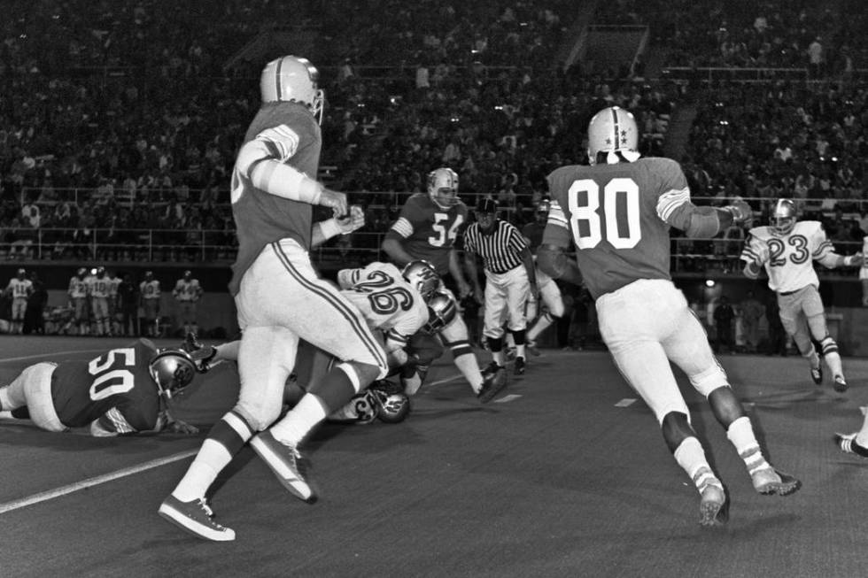 Historical images from the Las Vegas Review-Journal archive document the first UNLV football ga ...