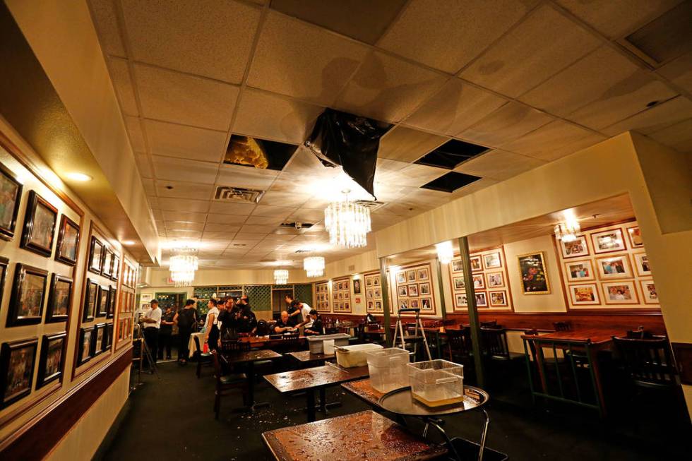 Water drips down from the ceiling of Thai restaurant Lotus of Siam after a portion of its ceili ...