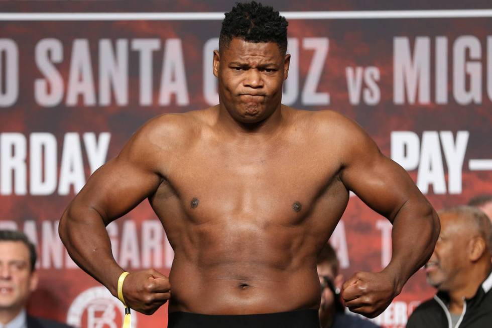 Luis Ortiz stands on the scale during a weigh-in at the MGM Grand Garden Arena in Las Vegas, Fr ...