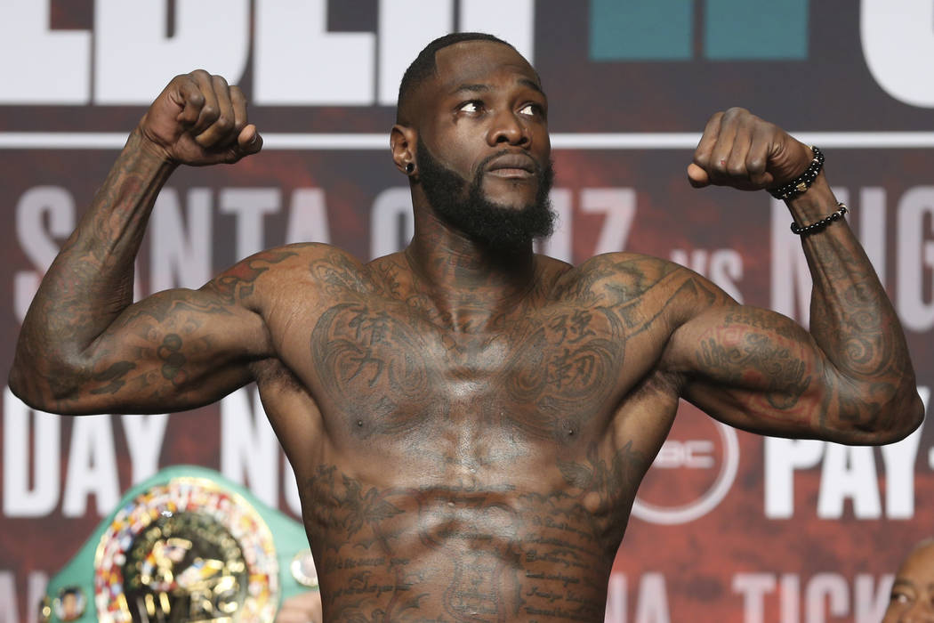 Deontay Wilder stands on the scale during a weigh-in at the MGM Grand Garden Arena in Las Vegas ...