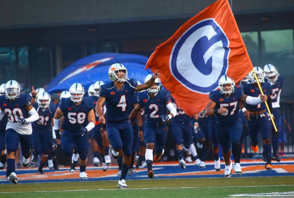 Bishop Gorman's Rome Odunze (4) points to the crowd as players enter the field before taking on ...