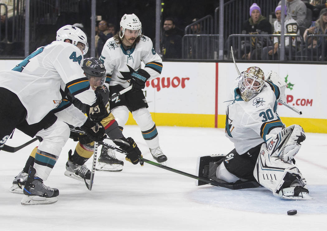 Vegas Golden Knights center Cody Eakin (21) shoots on San Jose Sharks goaltender Aaron Dell (30 ...