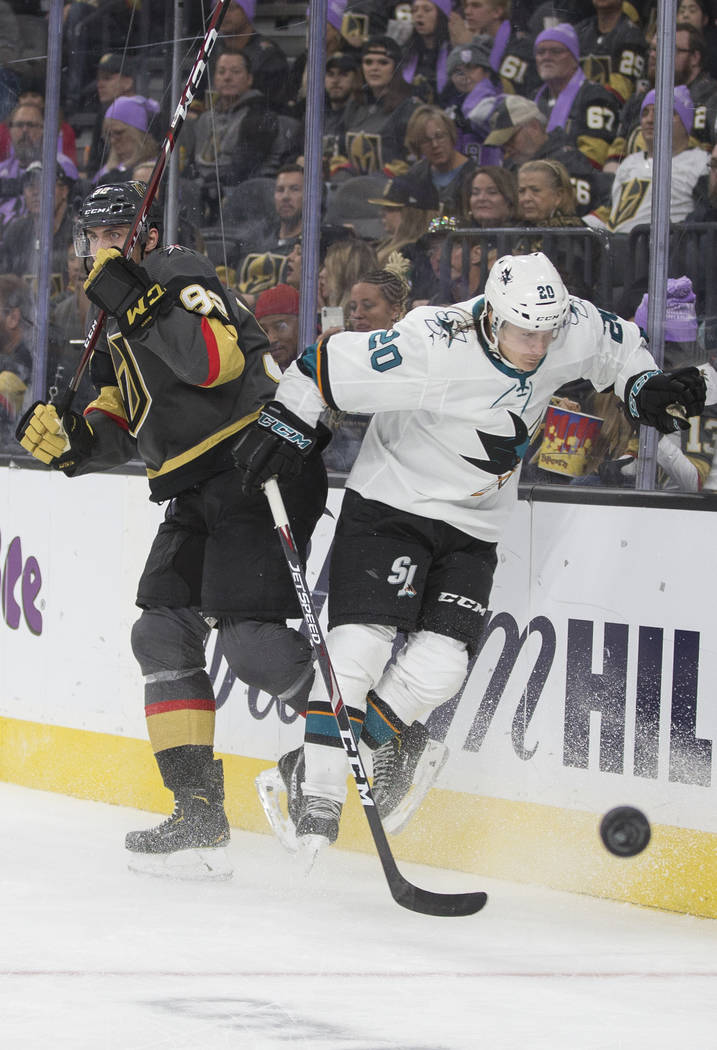 Vegas Golden Knights left wing Tomas Nosek (92) collides with San Jose Sharks left wing Marcus ...