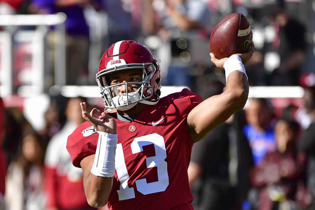 Alabama quarterback Tua Tagovailoa (13) warms up before an NCAA football game against LSU, Satu ...