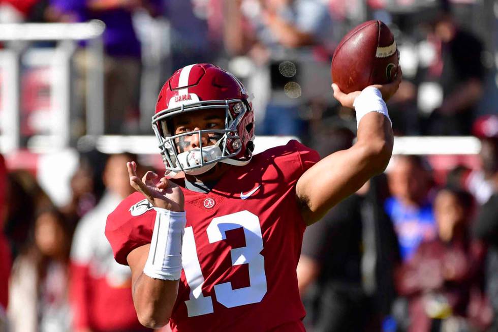 Alabama quarterback Tua Tagovailoa (13) warms up before an NCAA football game against LSU, Satu ...