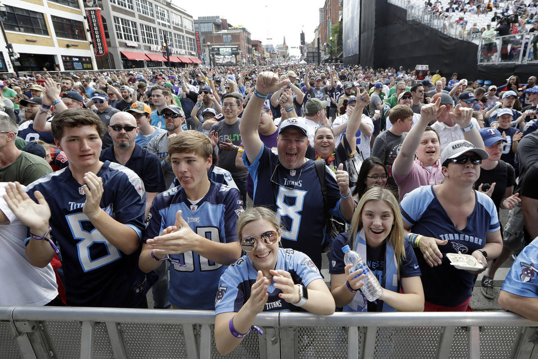 Fans attend the final day of the NFL football draft Saturday, April 27, 2019, in Nashville, Ten ...